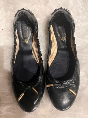 Tod's Black Leather Ballet Flats with Gold-Tip Bow